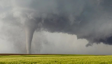 Tornado moving through open field