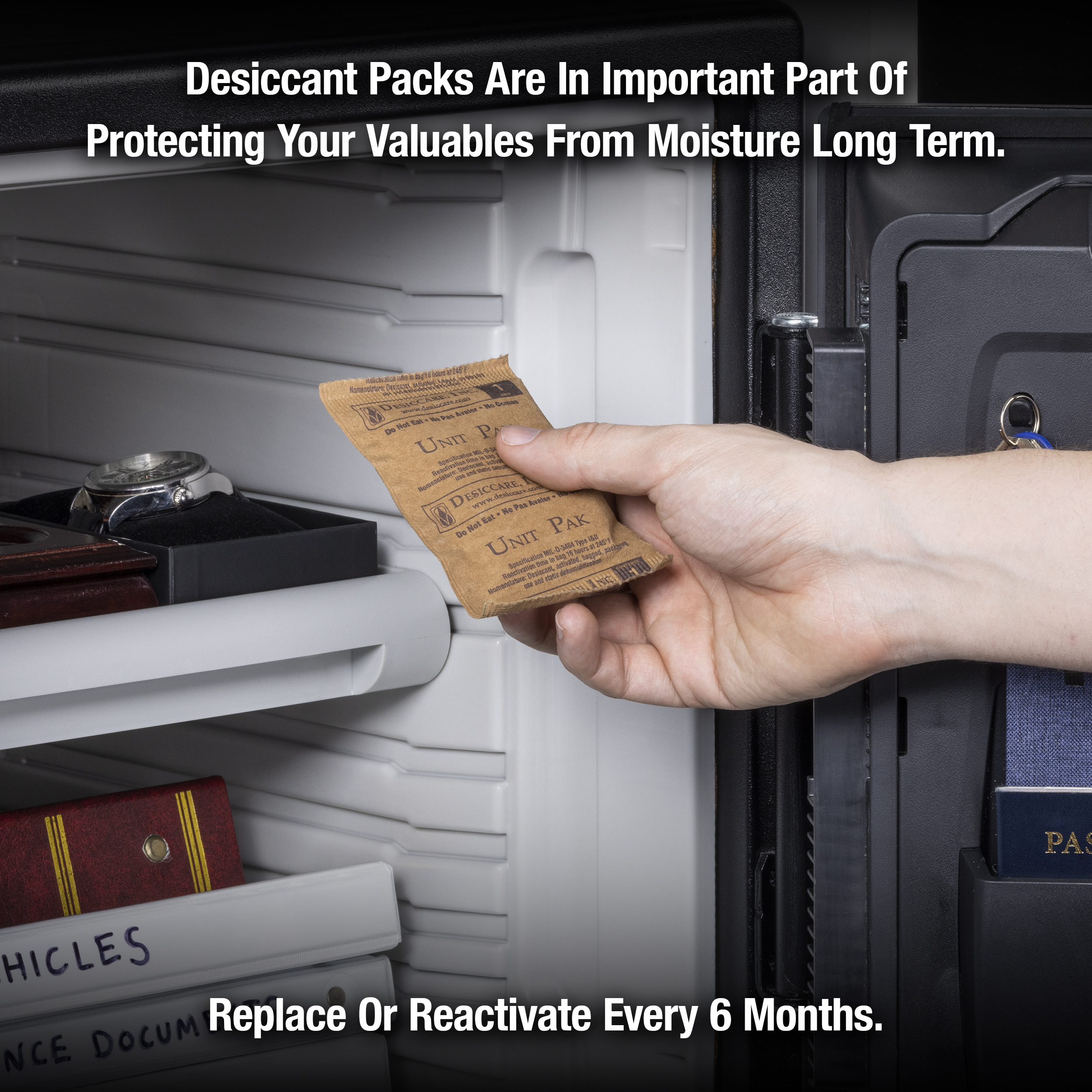 A hand holding a desiccant pack and placing it into a safe