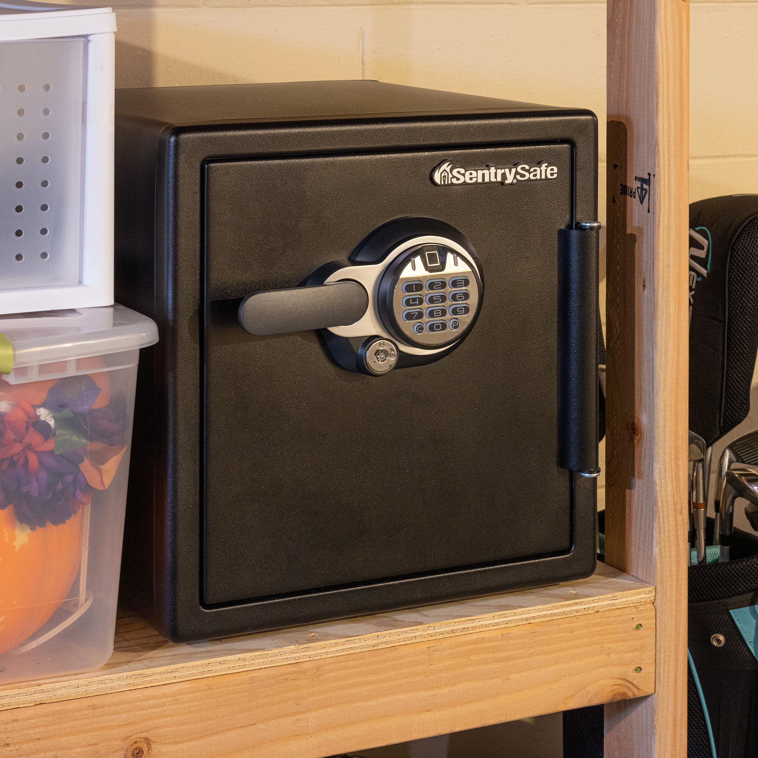 SentrySafe SFW123BTC stored on a wooden shelf in basement