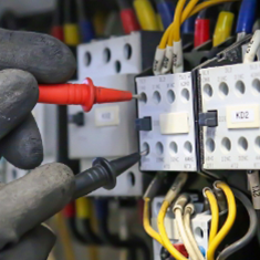 Technician operating electrical wiring